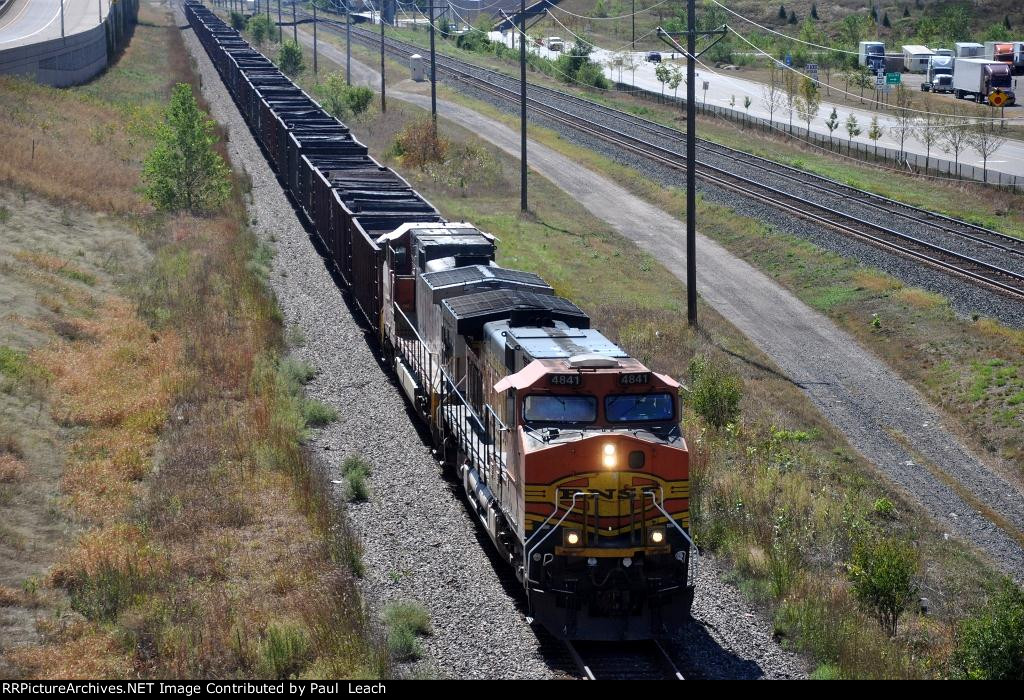 Empty all-rail rolls west